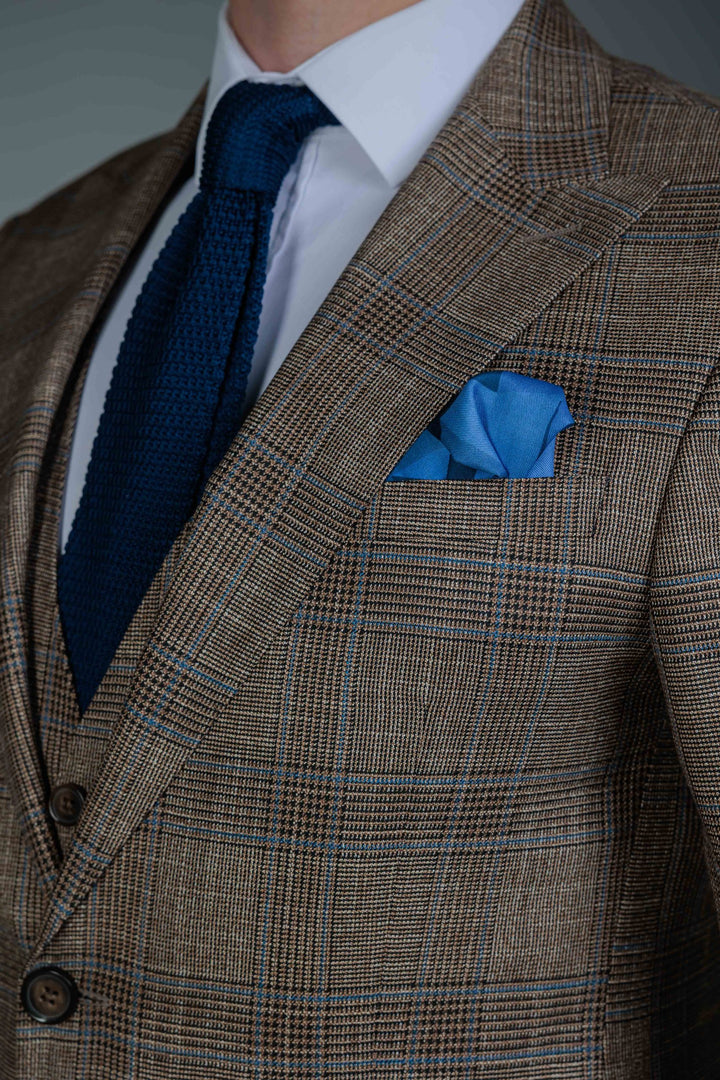 Three-piece brown check suit
