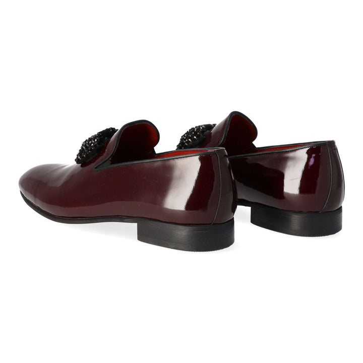 Burgundy patent leather loafers with black detail