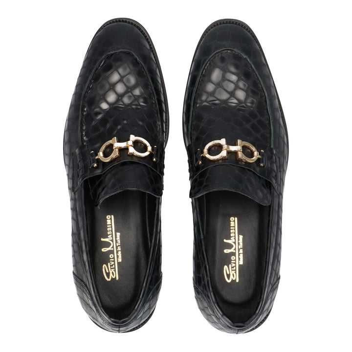 Black leather loafers with gold detail