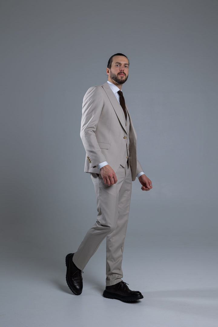 Three-piece suit in cream color