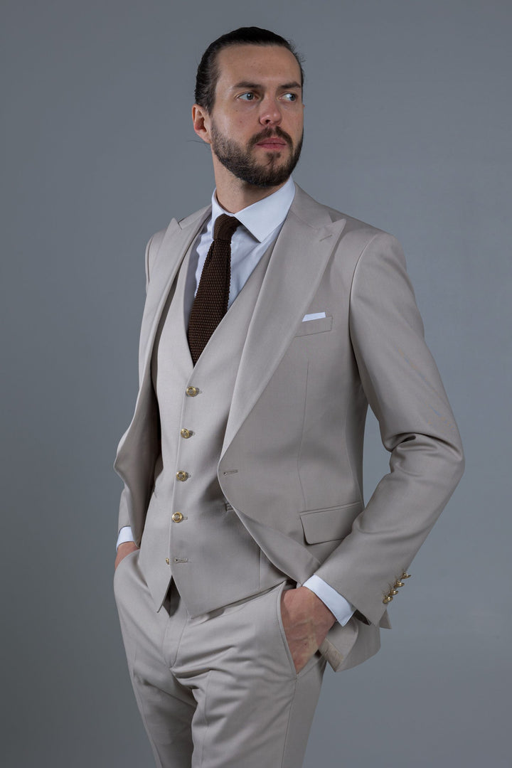 Three-piece suit in cream color