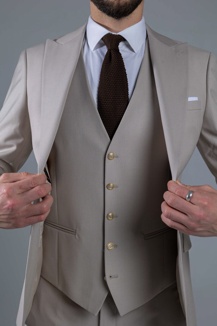 Three-piece suit in cream color