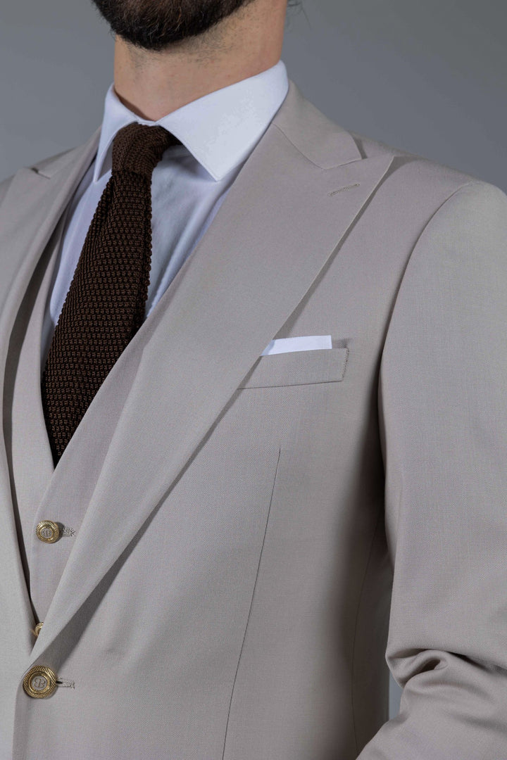 Three-piece suit in cream color