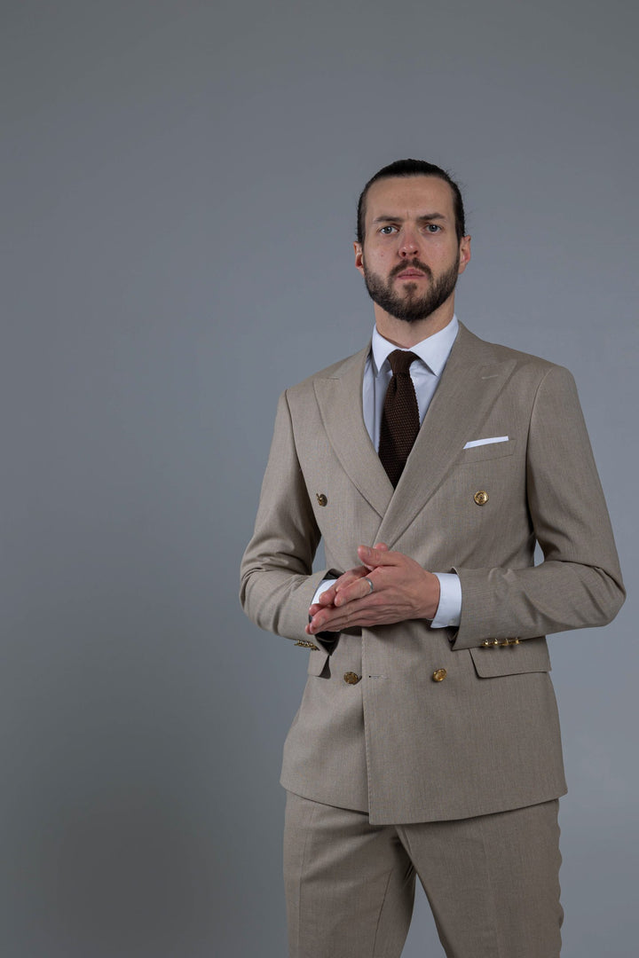 Two-piece cream suit with double-breasted jacket