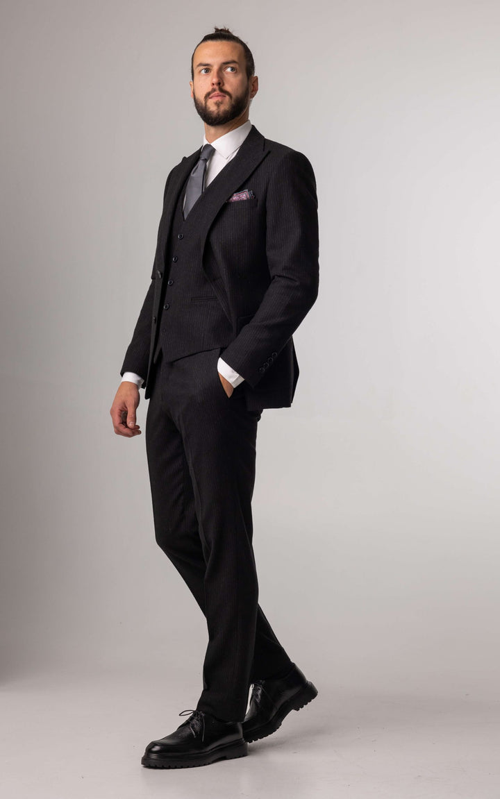 Three-piece black suit with blurred lines