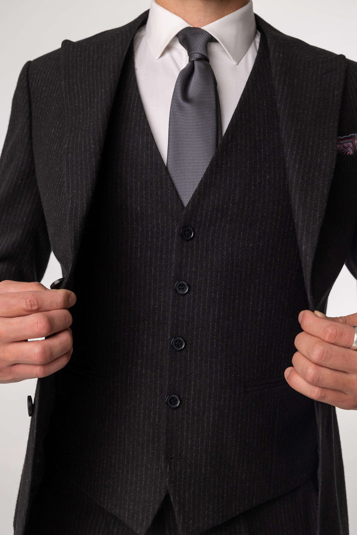 Three-piece black suit with blurred lines