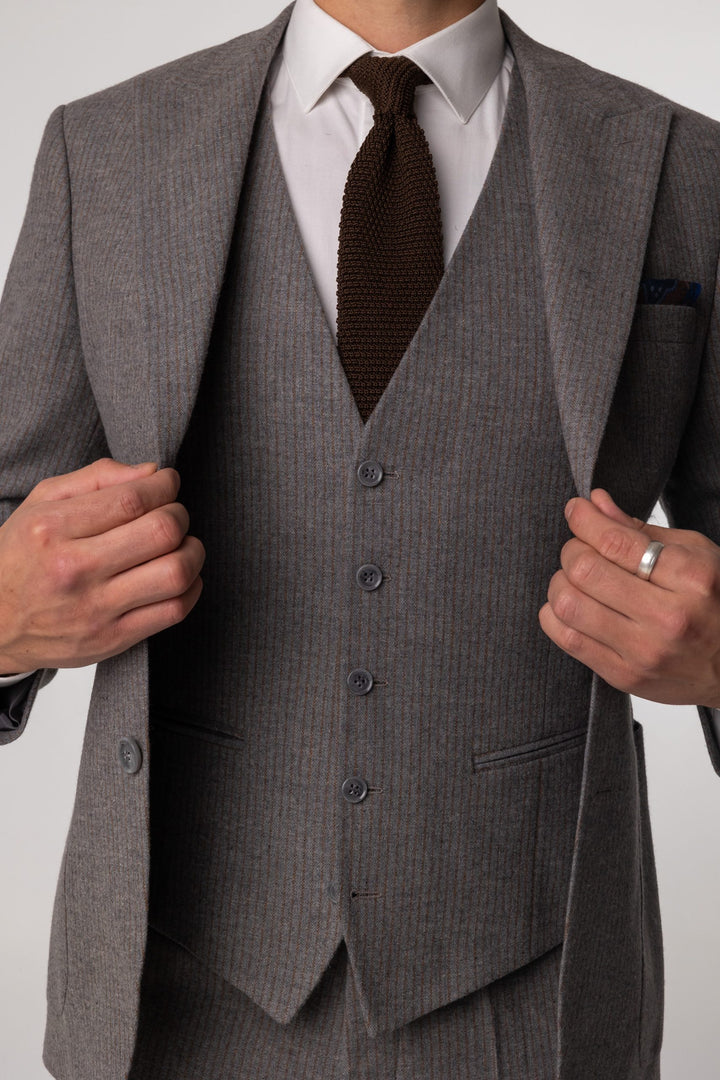 Three-piece gray suit with brown stripes