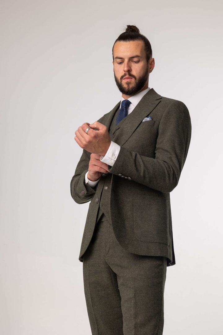 Green three-piece suit