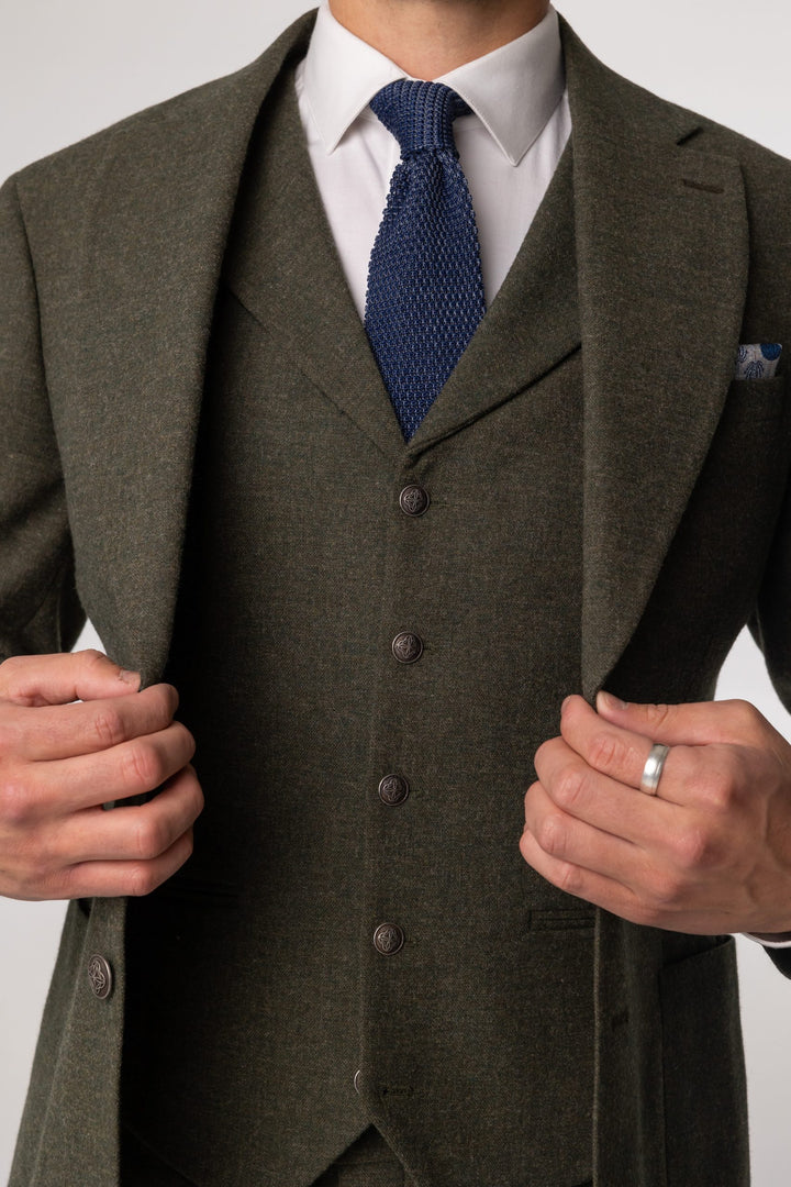 Green three-piece suit