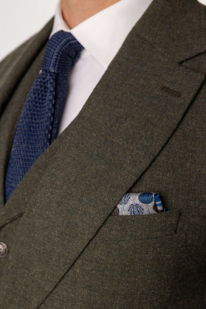 Green three-piece suit