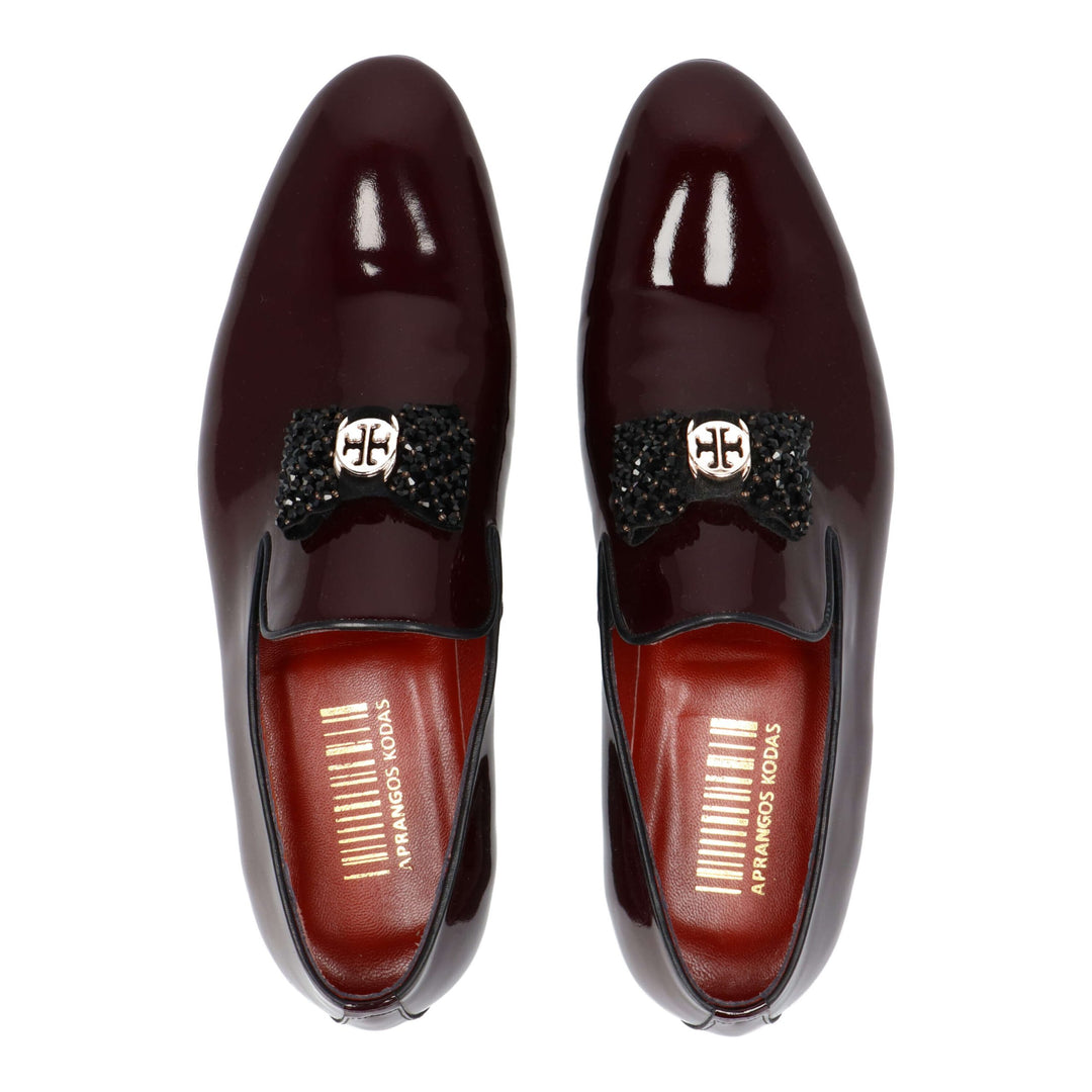 Burgundy patent leather loafers with black detail