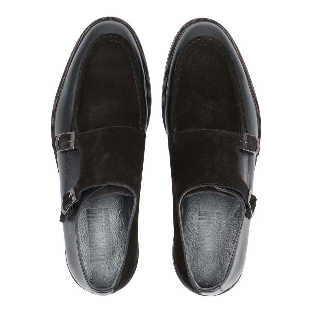 Black leather loafers with two buckles and a twisted leather detail
