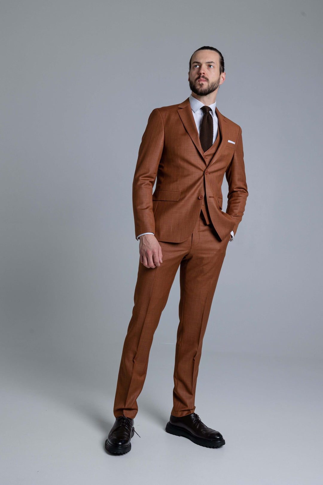 Three-piece brown suit