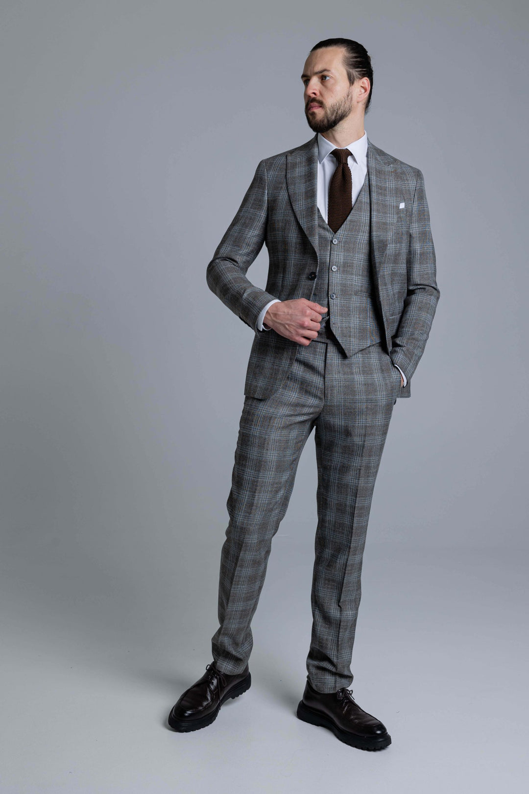 Three-piece gray-brown checked suit