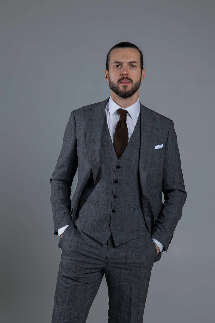 Three-piece gray suit with brown check