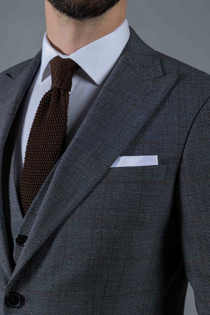 Three-piece gray suit with brown check