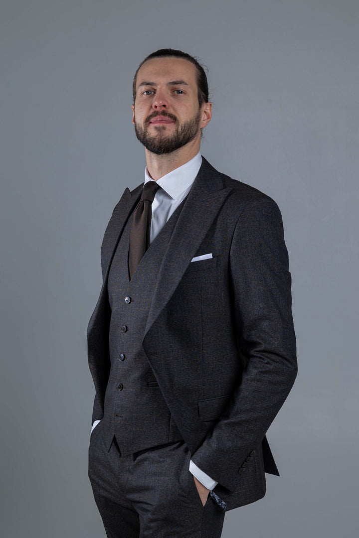 Three-piece suit in dark brown with a small blue pattern