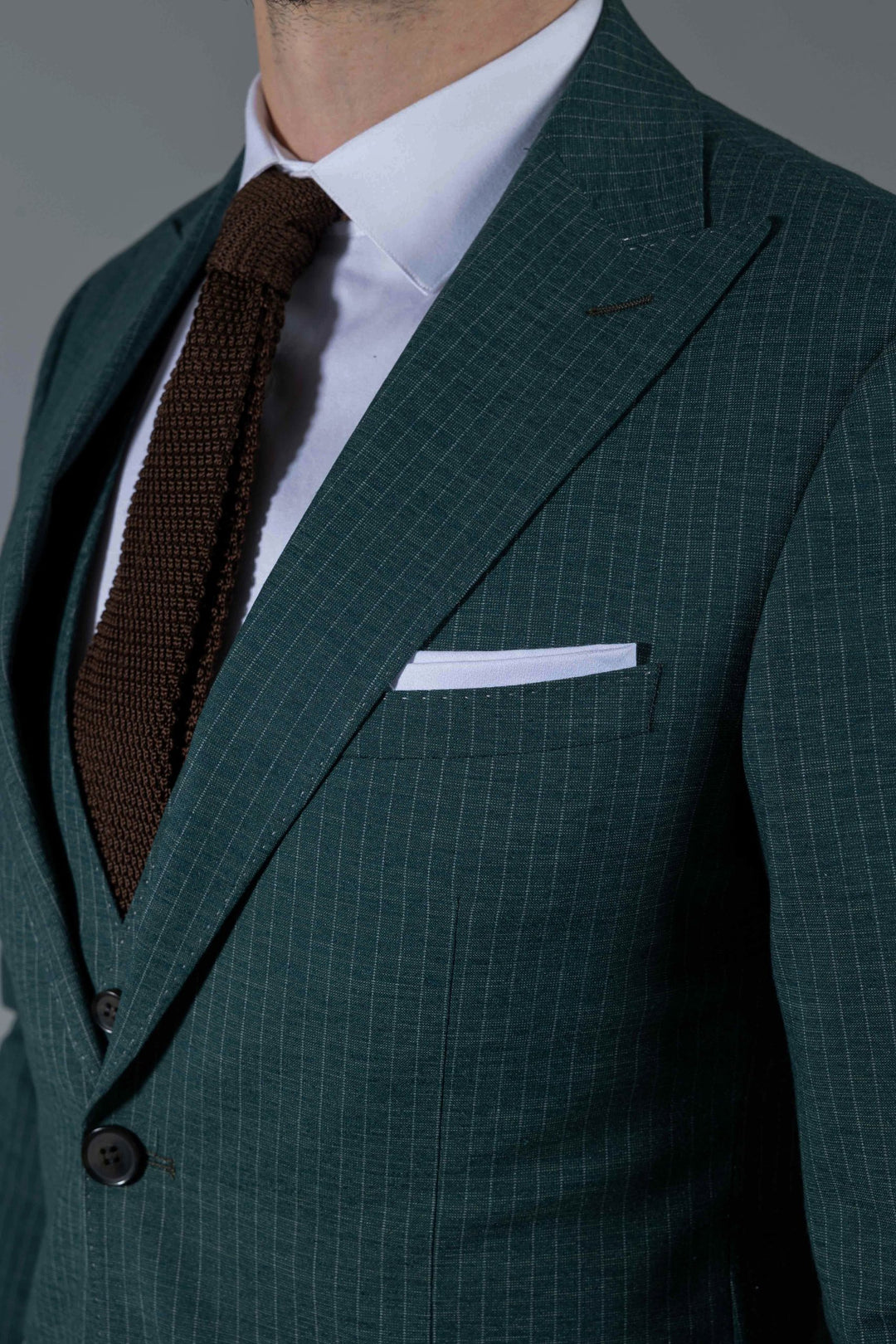 Three-piece green suit with stripes