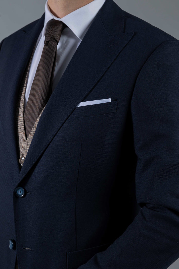 Three-piece navy blue suit with light brown waistcoat