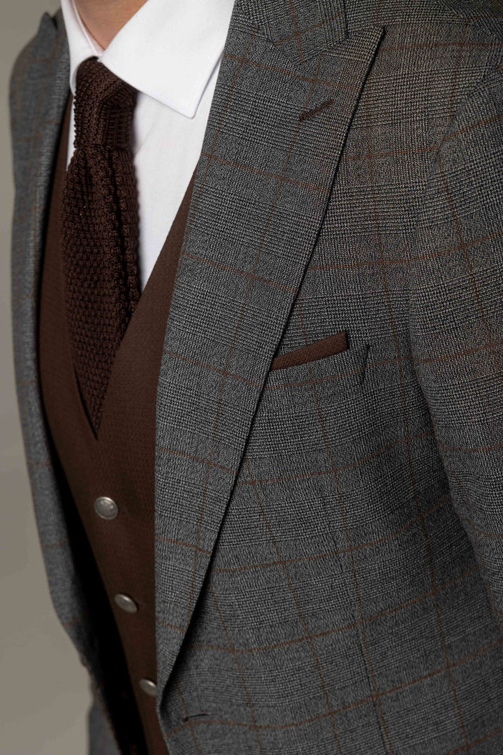 Three-piece gray suit with a brown waistcoat