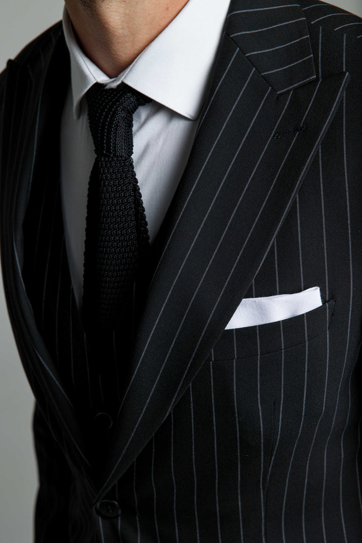 Three-piece black suit with stripes
