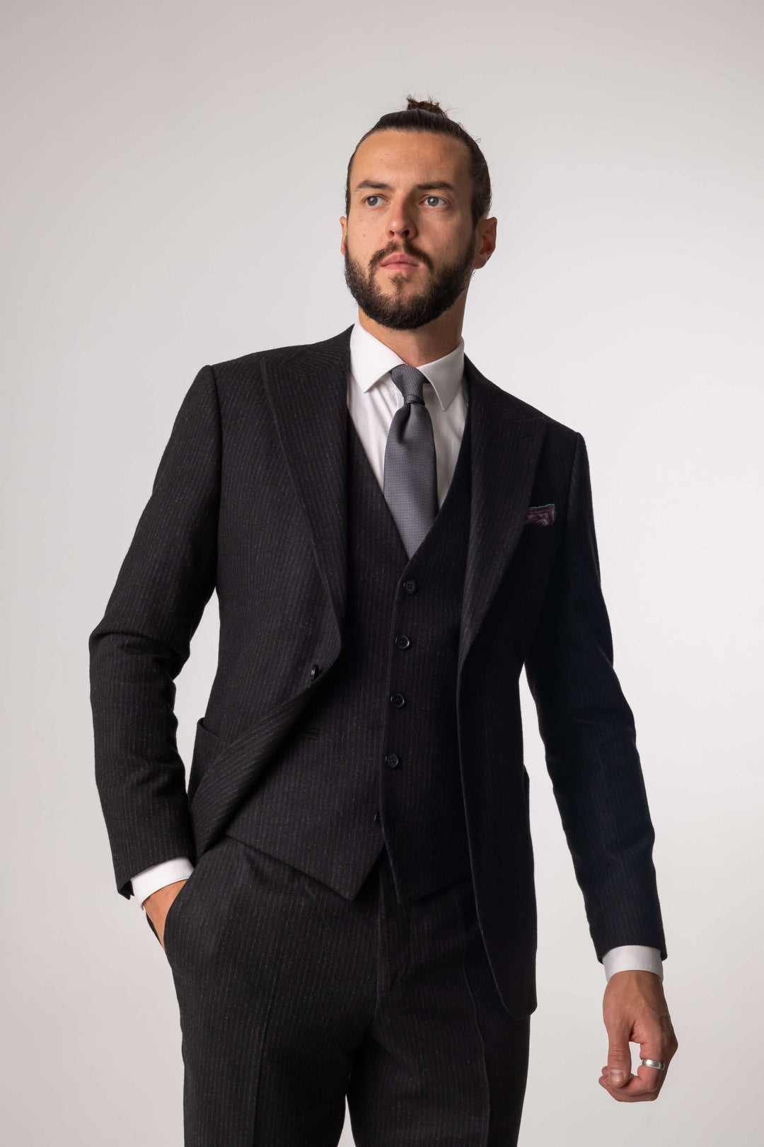Three-piece black suit with blurred lines