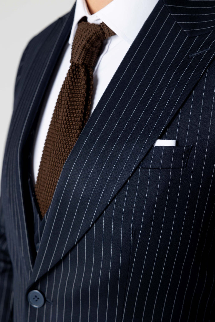 Three-piece suit in dark blue with stripes