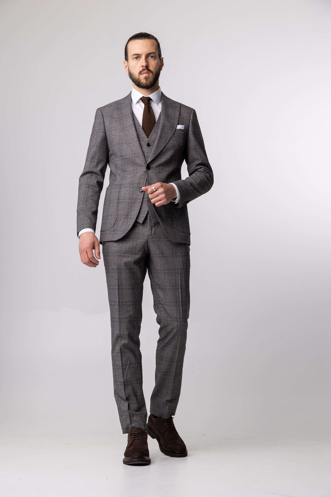 Three-piece gray suit with fine print