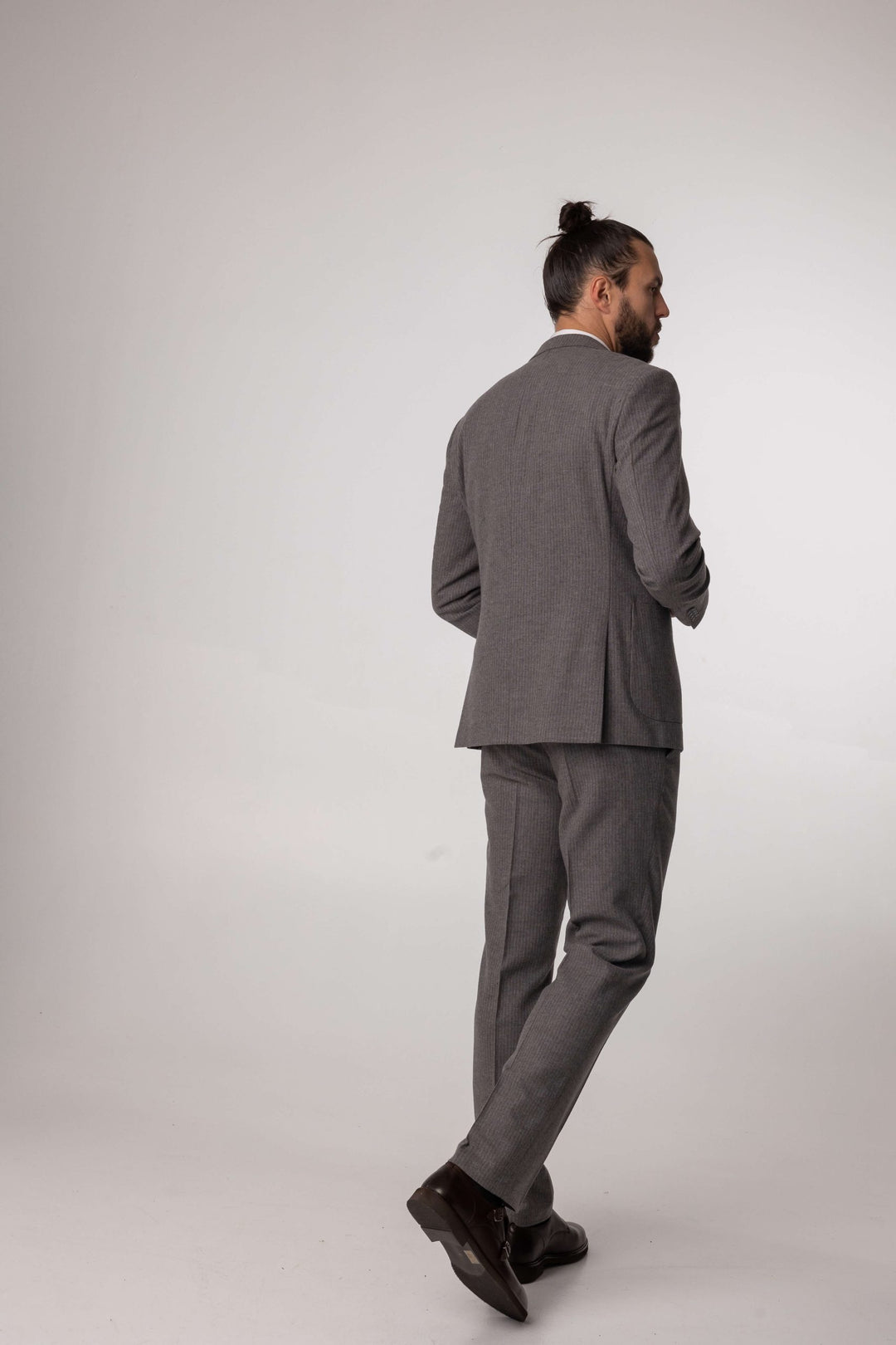 Three-piece gray suit with brown stripes