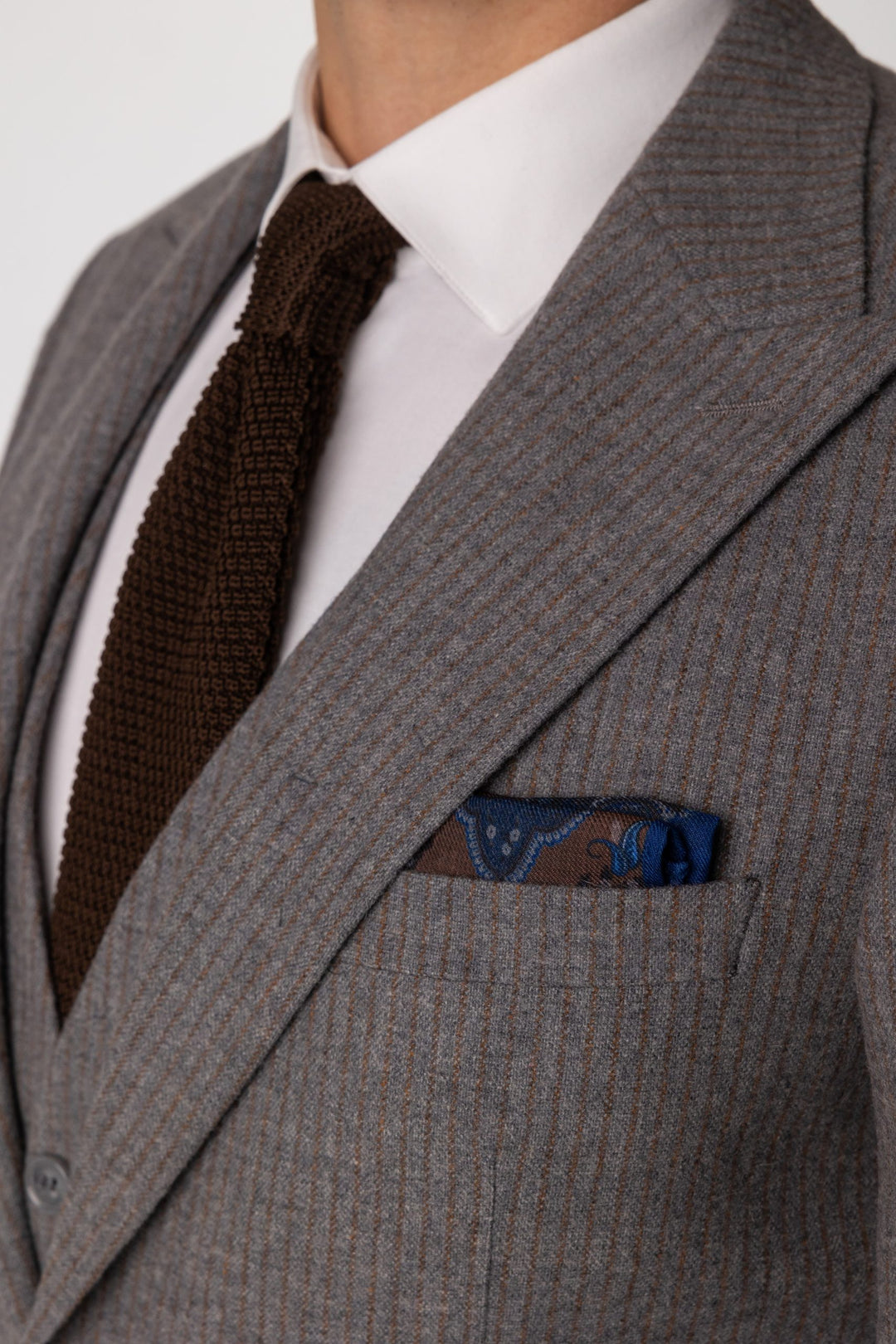 Three-piece gray suit with brown stripes
