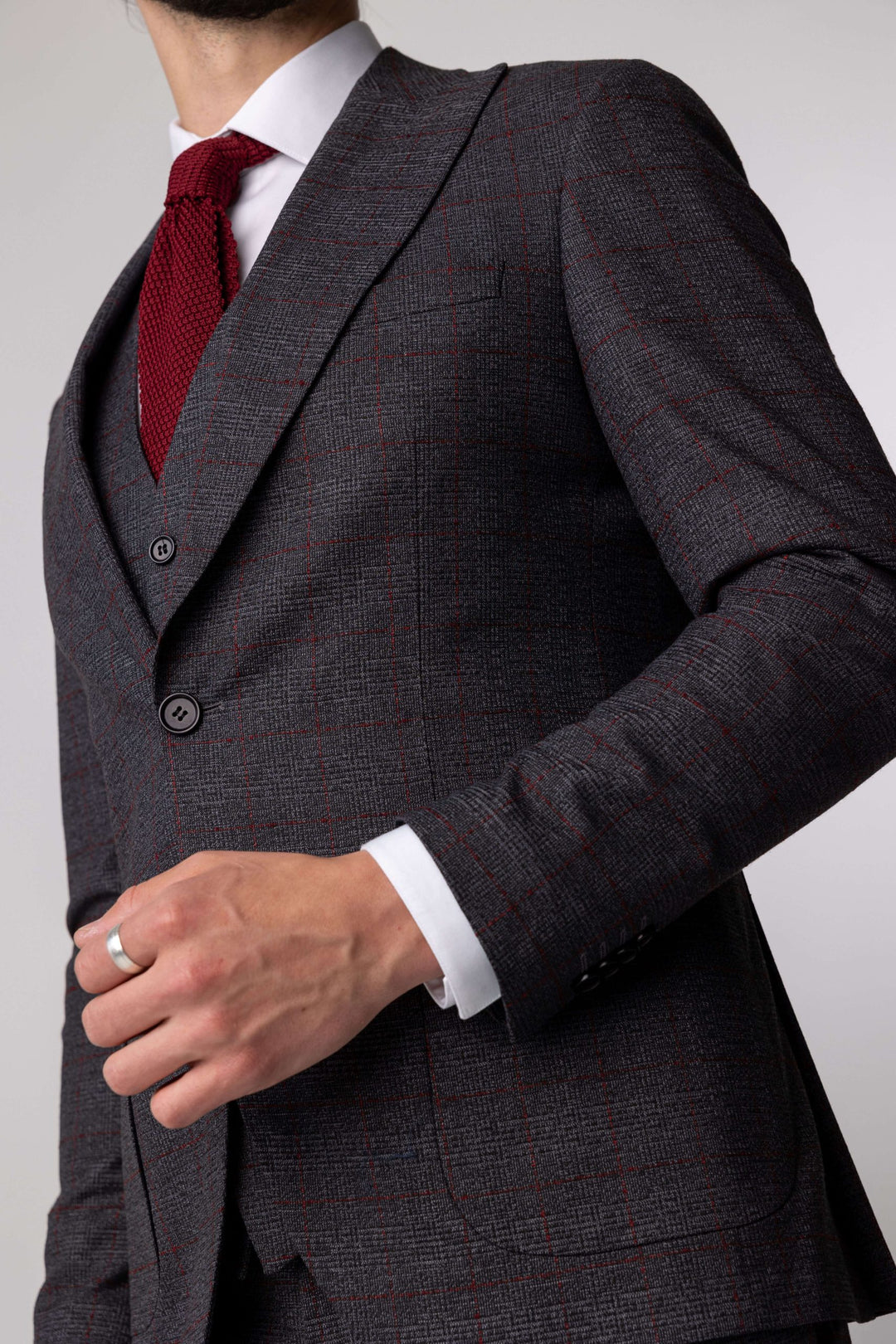 Three-piece gray suit with burgundy checks