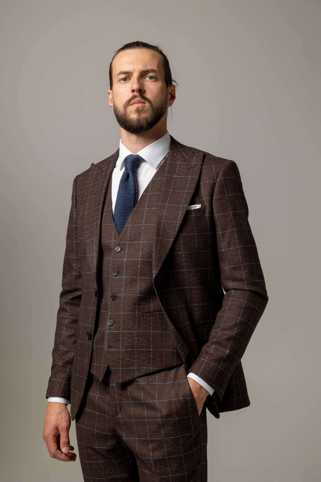 Three-piece brown check suit