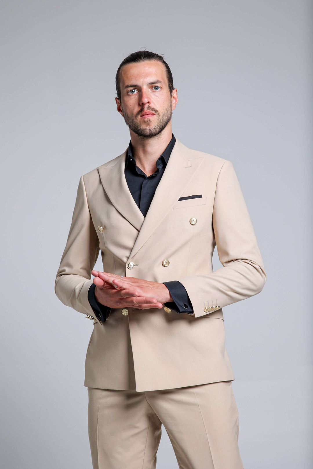 Two-piece cream suit with double-breasted jacket
