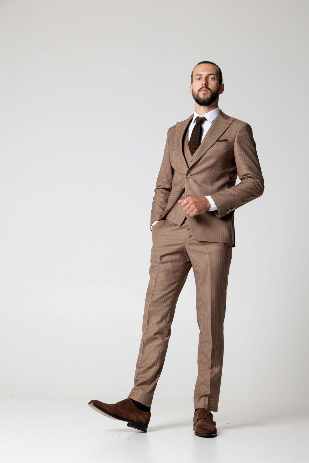 Light brown three-piece suit with fine lines