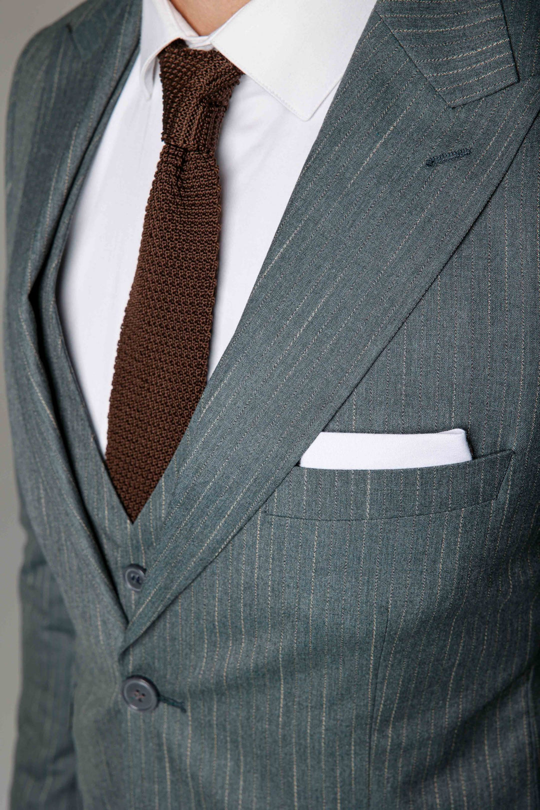 Three-piece teal suit with stripes