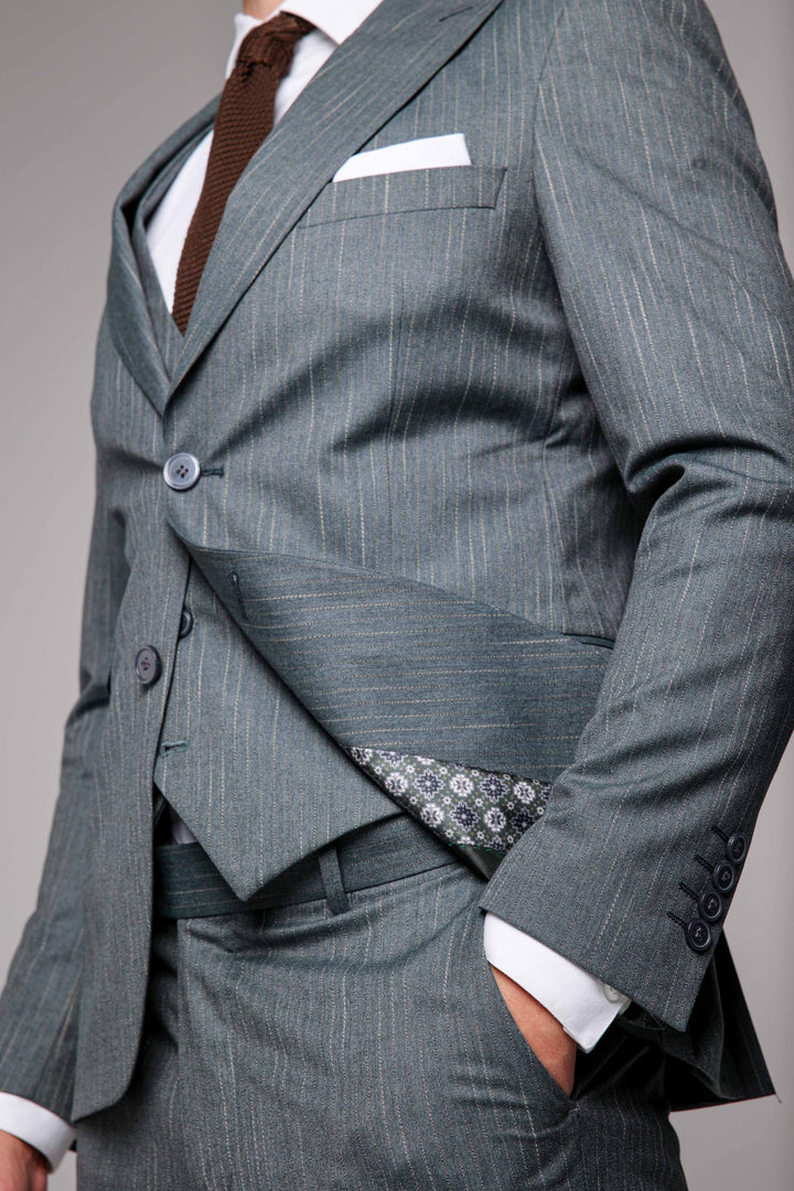 Three-piece teal suit with stripes